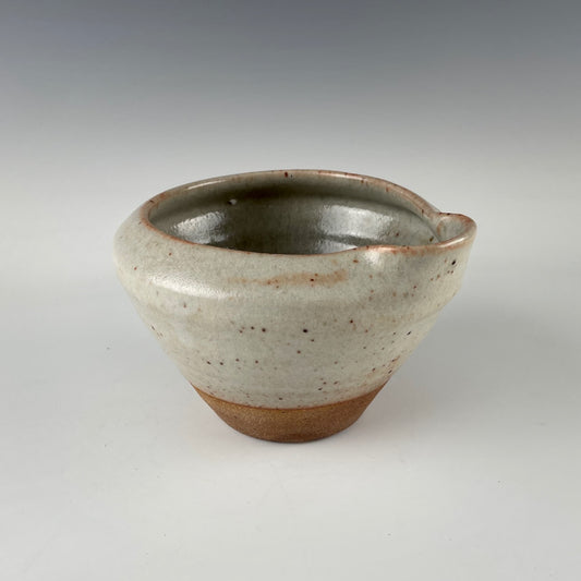 Guillermo Cuellar pouring pot