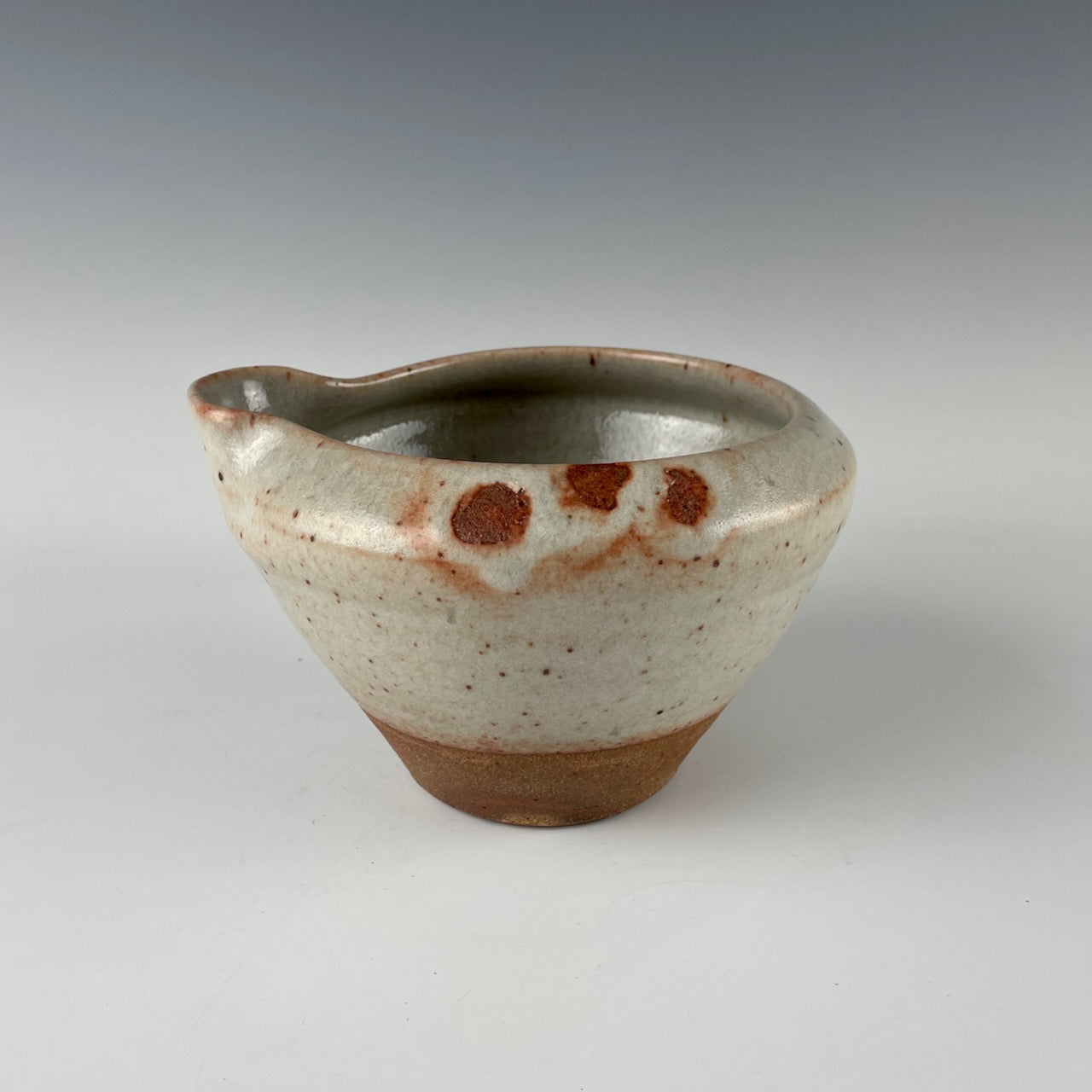 Guillermo Cuellar pouring pot
