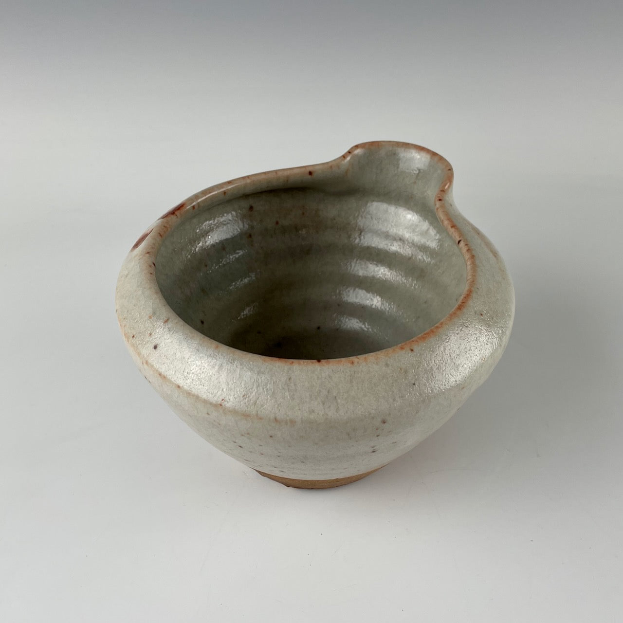 Guillermo Cuellar pouring pot